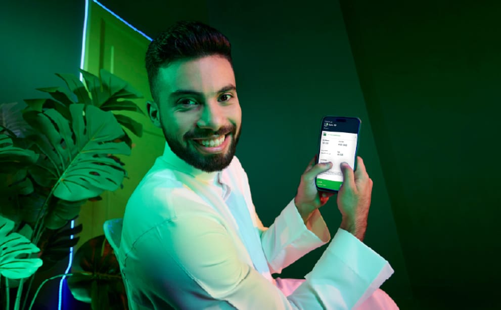 Man using his phone on a Salam mobile add-on pack for uninterrupted data in Saudi Arabia